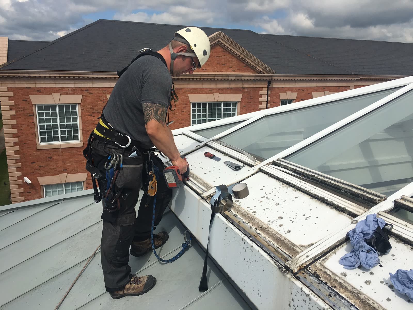ARRT Group glazier working on glass skylight structure