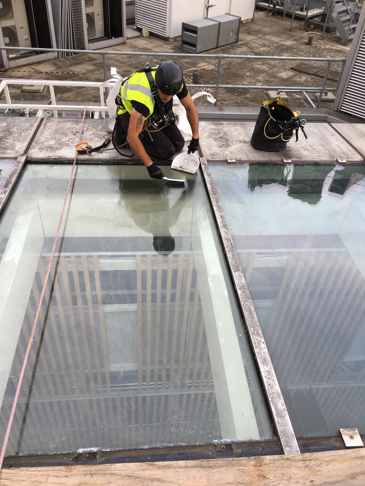 Close-up of rooflight seal replacement during maintenance works