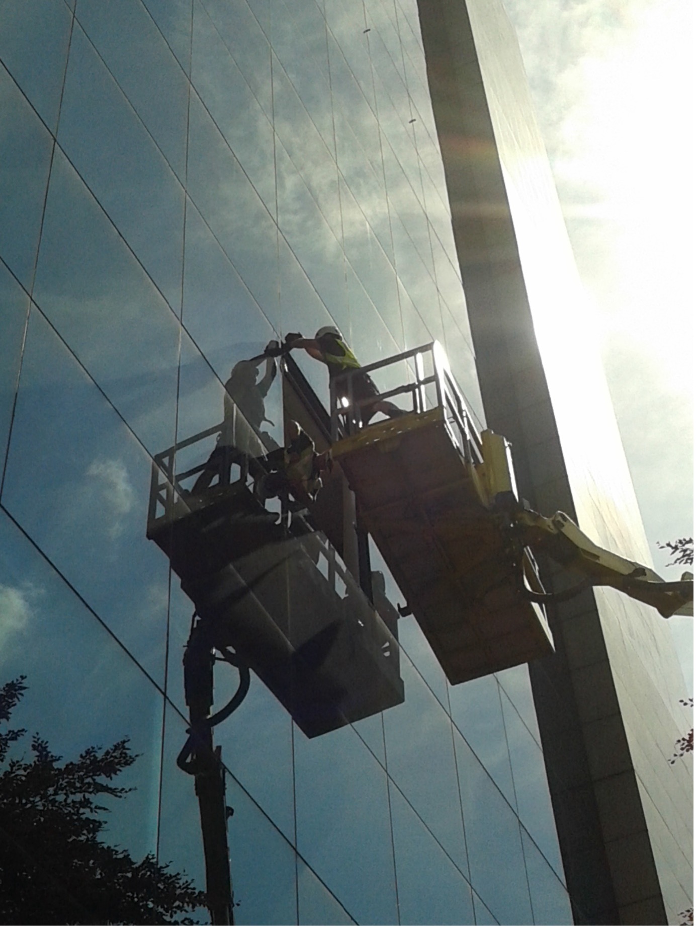 ARRT Group glaziers on cherry picker installing commercial curtain wall glazing