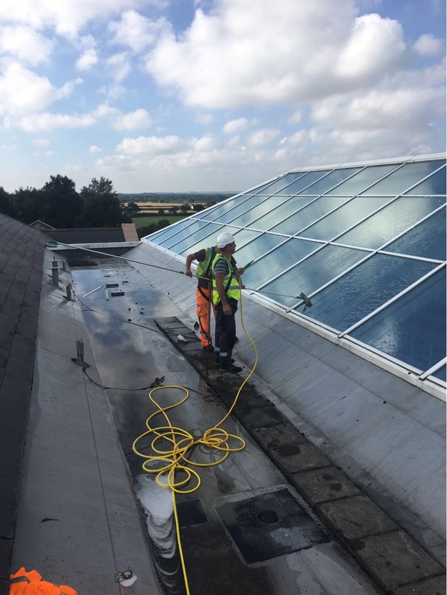 ARRT Group roofer working on flat roof and skylight